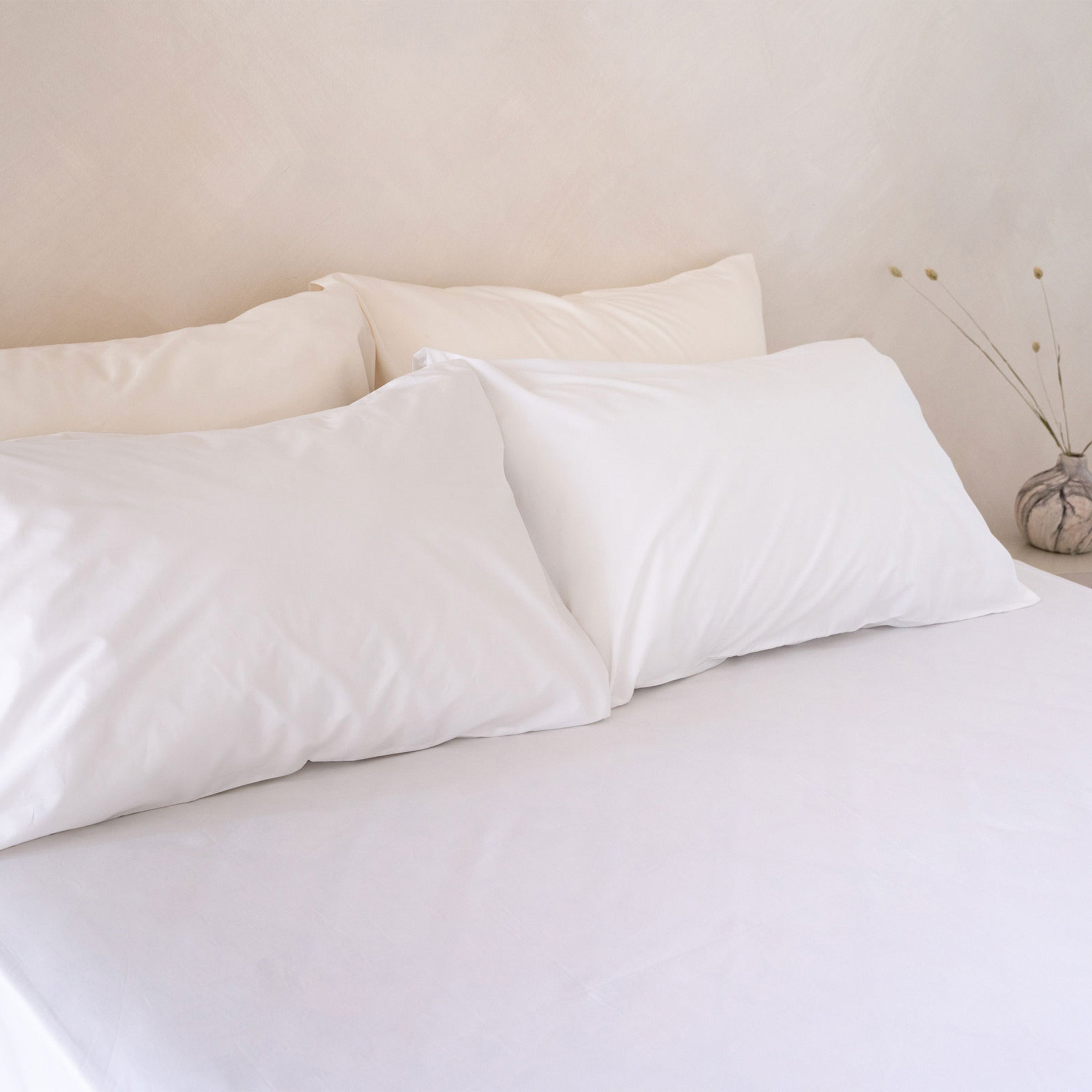 crisp-white-sheet-set-in-bedroom-by-sojao