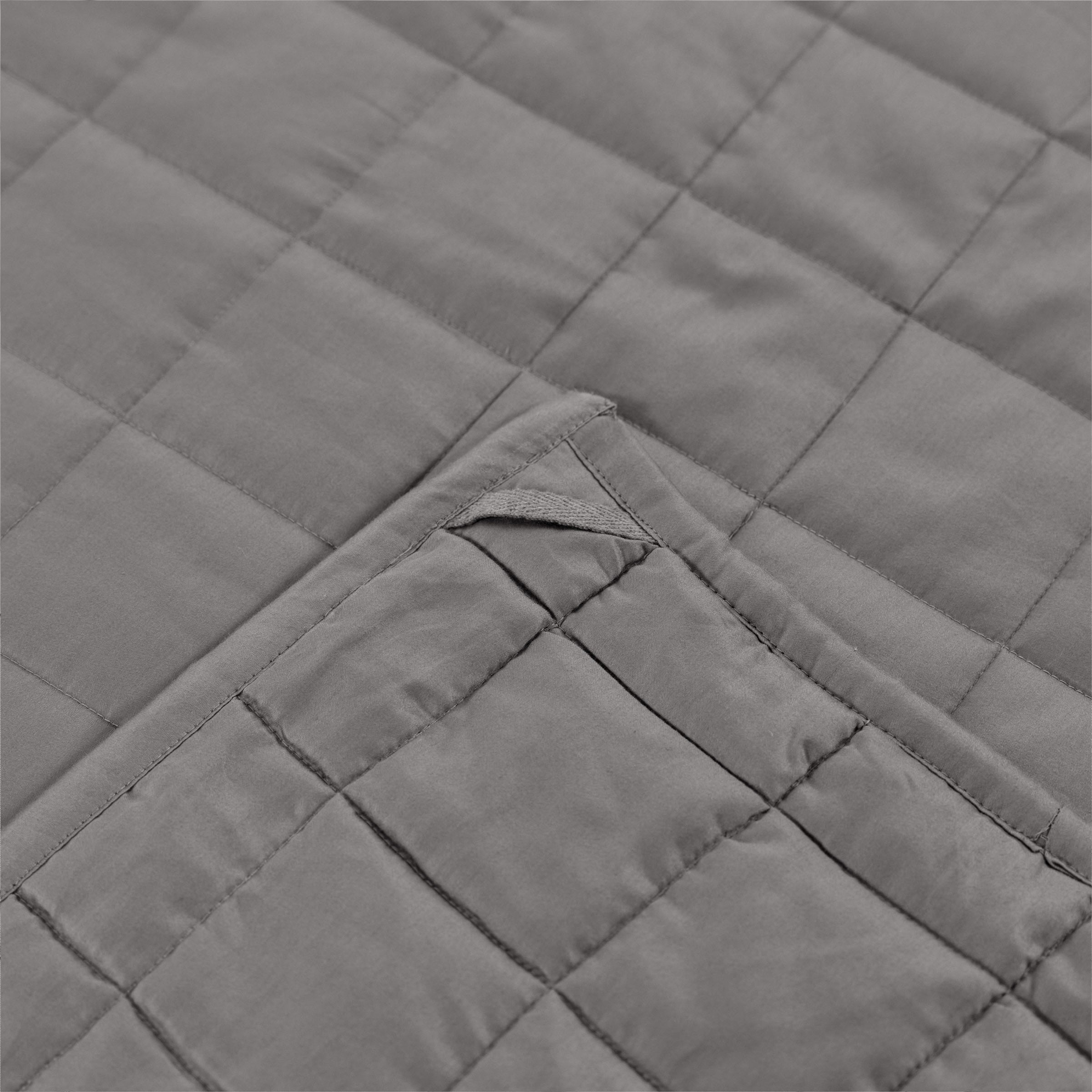 organic-cotton-quilt-in-stone-colour-corner-loop-detail-by-sojao