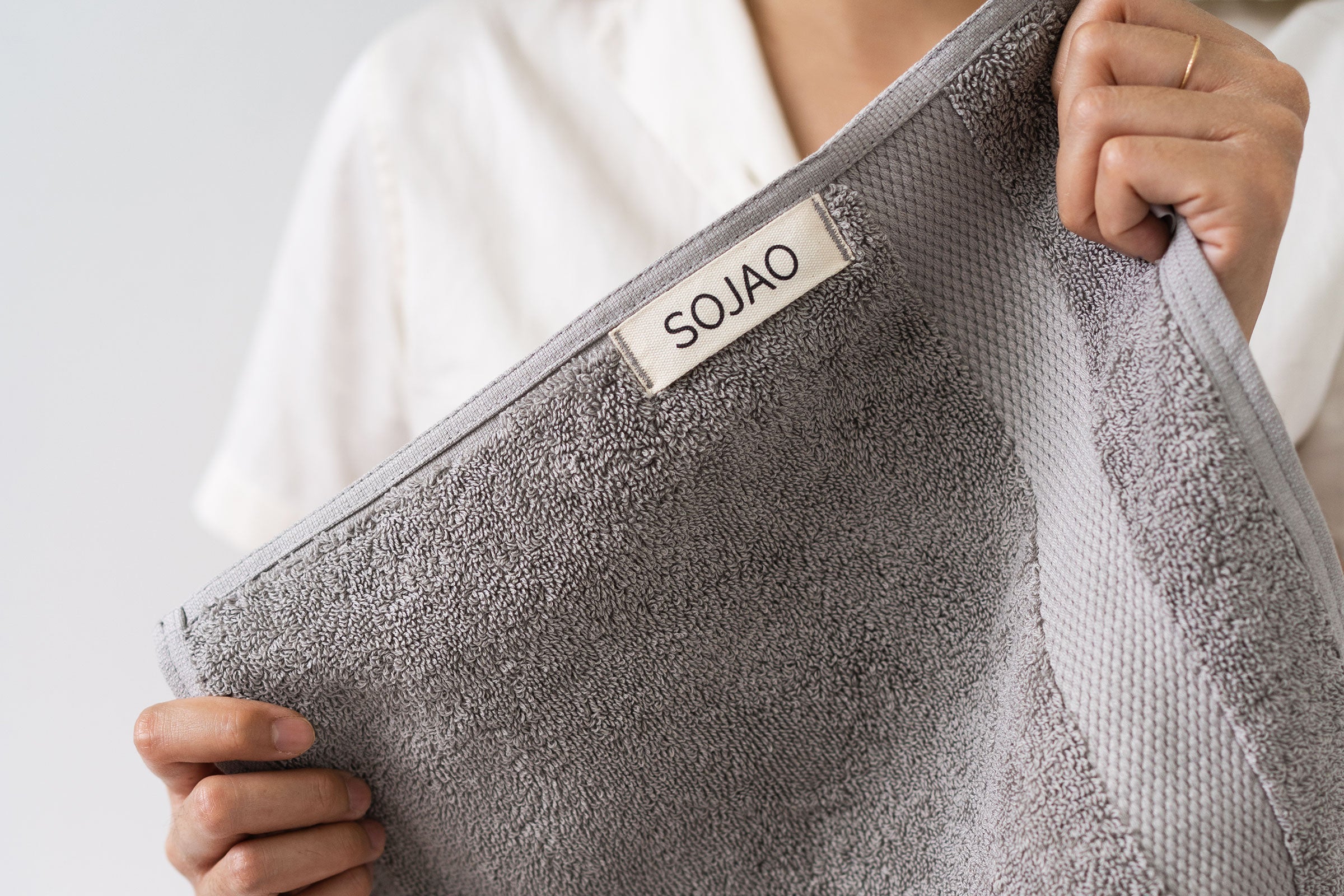 organic-cotton-face-towel-pair-in-stone-colour-with-SOJAO-tag-by-sojao