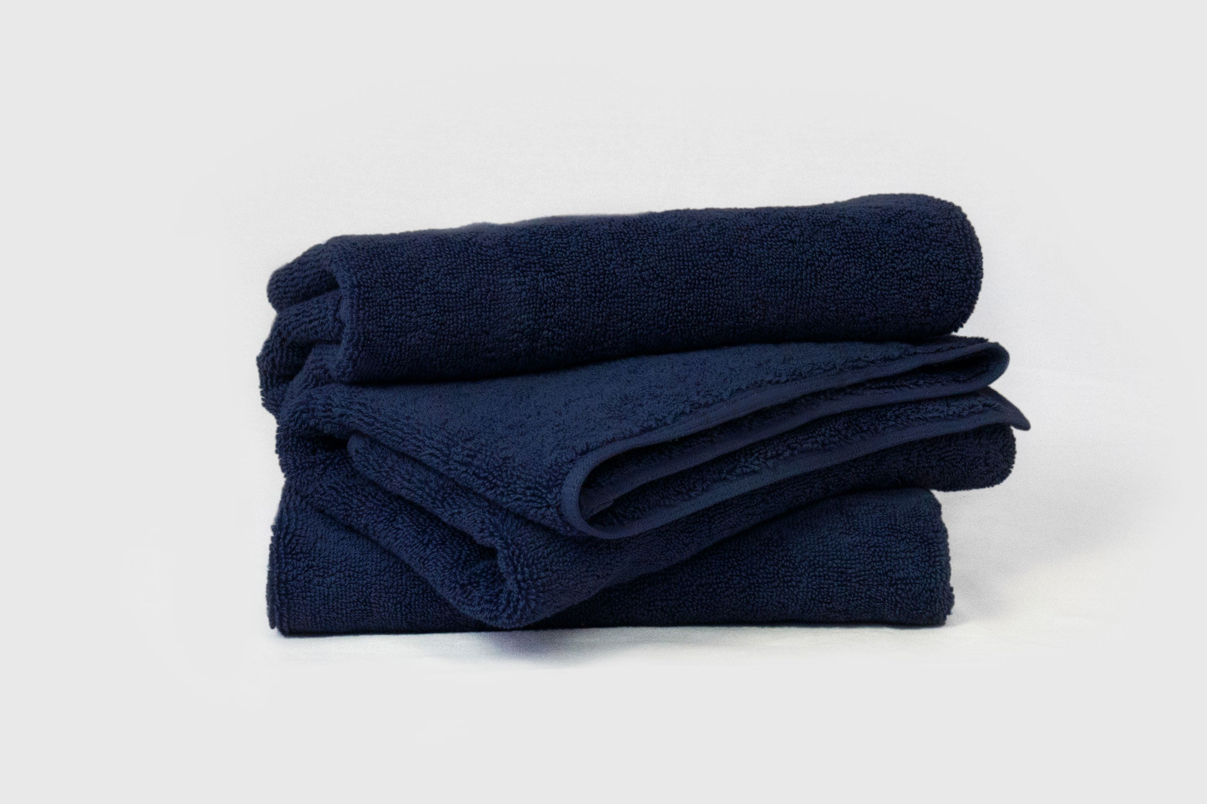 organic-cotton-hand-towel-in-navy-colour-stacked-by-sojao