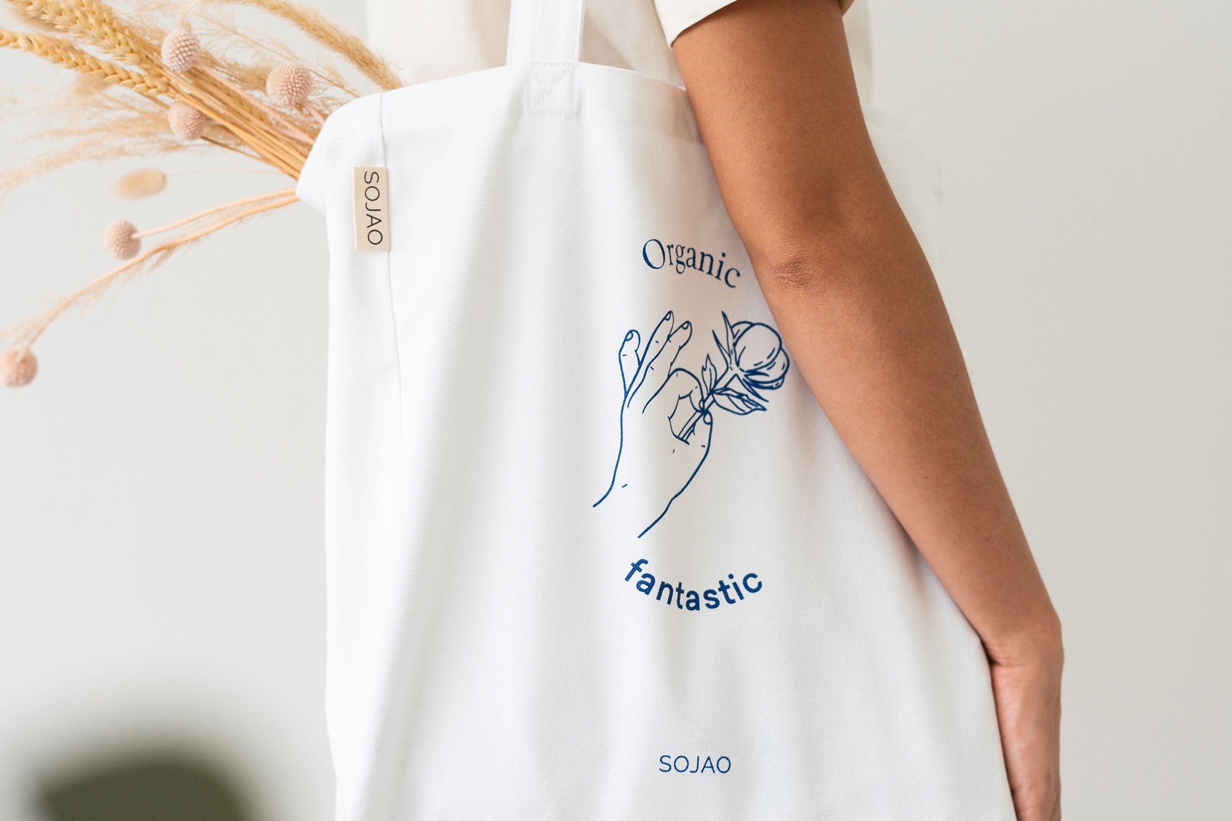 organic-cotton-tote-bag-in-white-colour-carrying-plants-by-sojao