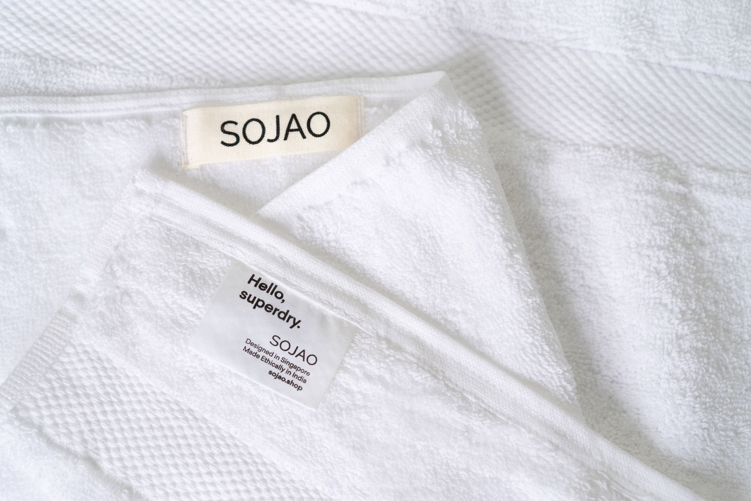 organic-cotton-hand-towel-in-white-colour-with-SOJAO-tag-by-sojao