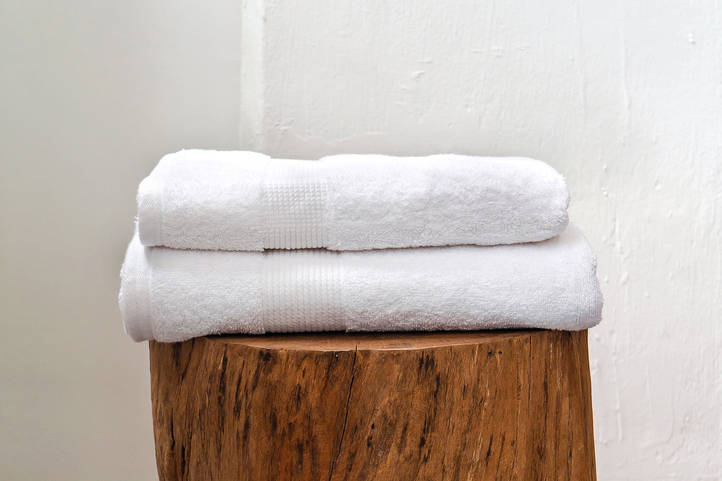 organic-cotton-bath-towel-in-white-colour-on-wood-by-sojao